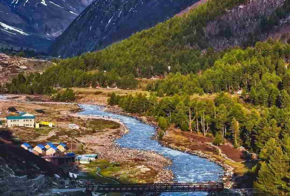 Chitkul village travel guide featuring scenic Himalayan landscapes, wooden houses, and river views in the last village of India