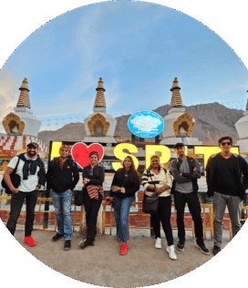 Travellers exploring Spiti Valley during a scenic mountain tour.